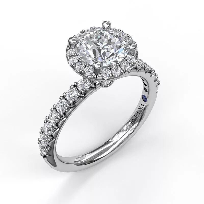 A white gold ring with a round diamond in the center