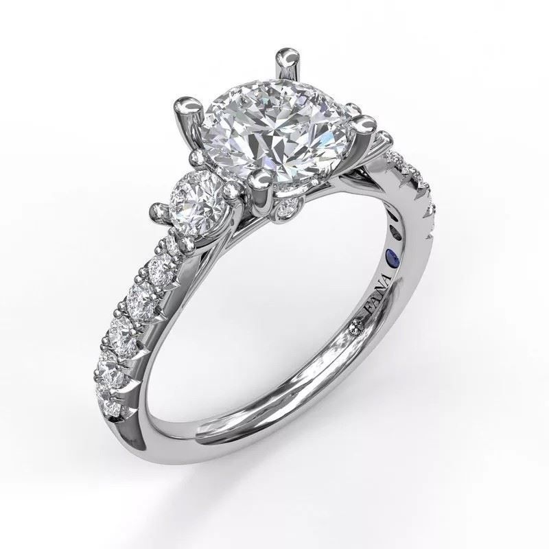 A white gold ring with a diamond in the center