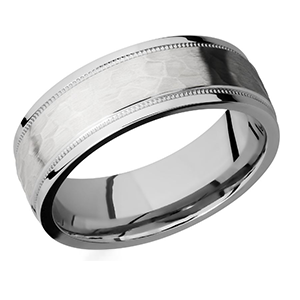 A silver ring with a hammered finish on a white background