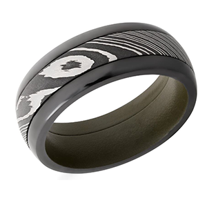 A black and white ring with a pattern on it