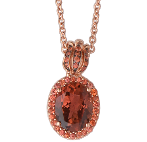 A necklace with a red stone in the center
