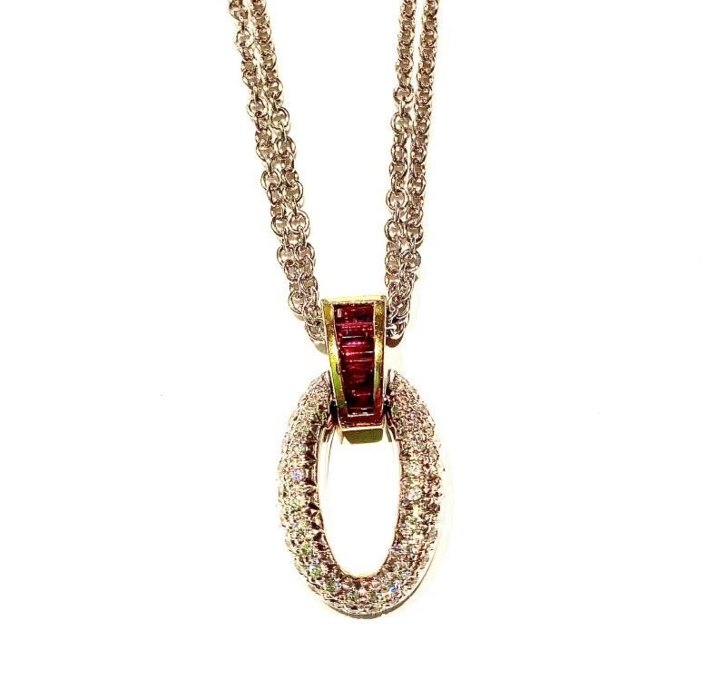 A necklace with a red stone in the middle