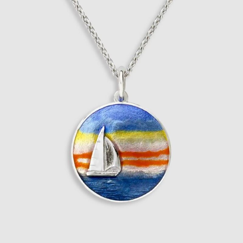 A necklace with a sailboat pendant on it