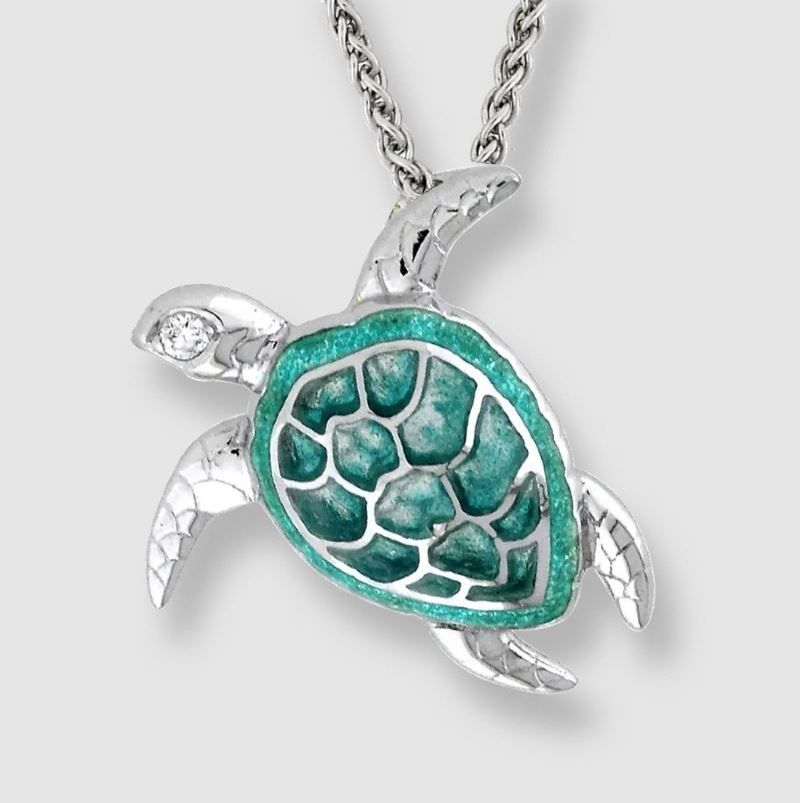 A necklace with a turtle shaped pendant on a chain