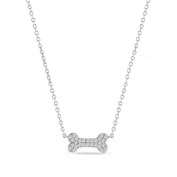 A necklace with a dog bone shaped pendant on a chain.