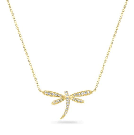 A gold necklace with a dragonfly pendant on a chain.