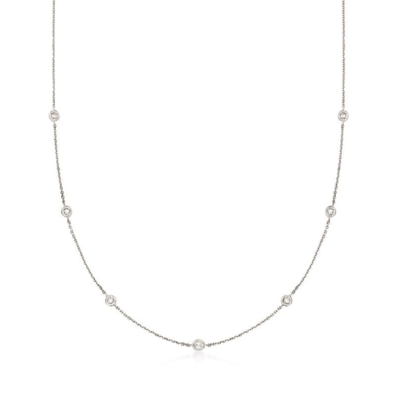 A necklace with pearls on a chain on a white background.