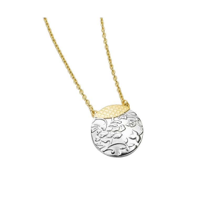 A gold and silver necklace with a round pendant