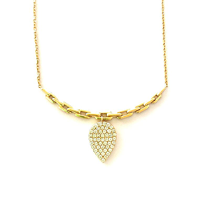 A gold necklace with a heart shaped pendant
