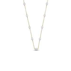 A gold necklace with diamonds on a white background