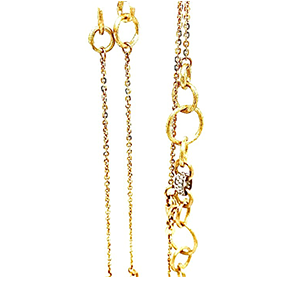 A pair of gold earrings and a gold chain on a white background