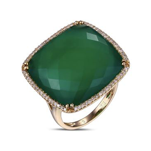 A gold ring with a green stone and diamonds