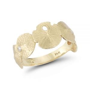 A yellow gold ring with a diamond in the center on a white background.