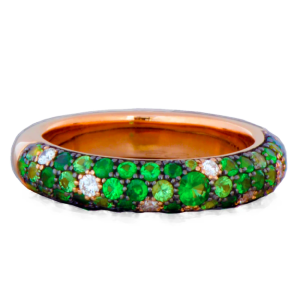 A ring with emeralds and diamonds on a white background