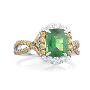 A ring with a green stone and yellow diamonds on a white background.