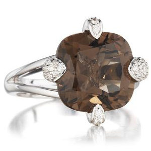A ring with a brown stone and white diamonds