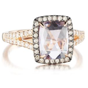 A ring with a square stone and diamonds on a white background.