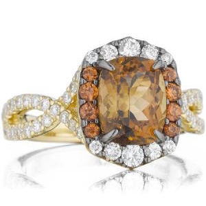 A yellow gold ring with a brown stone and white diamonds