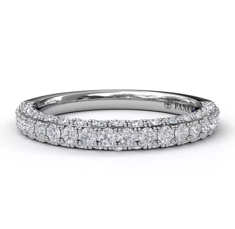 A white gold ring with a lot of diamonds on it