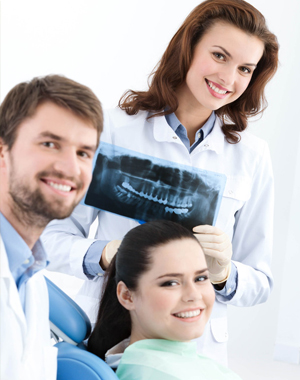 Dentists with their patient