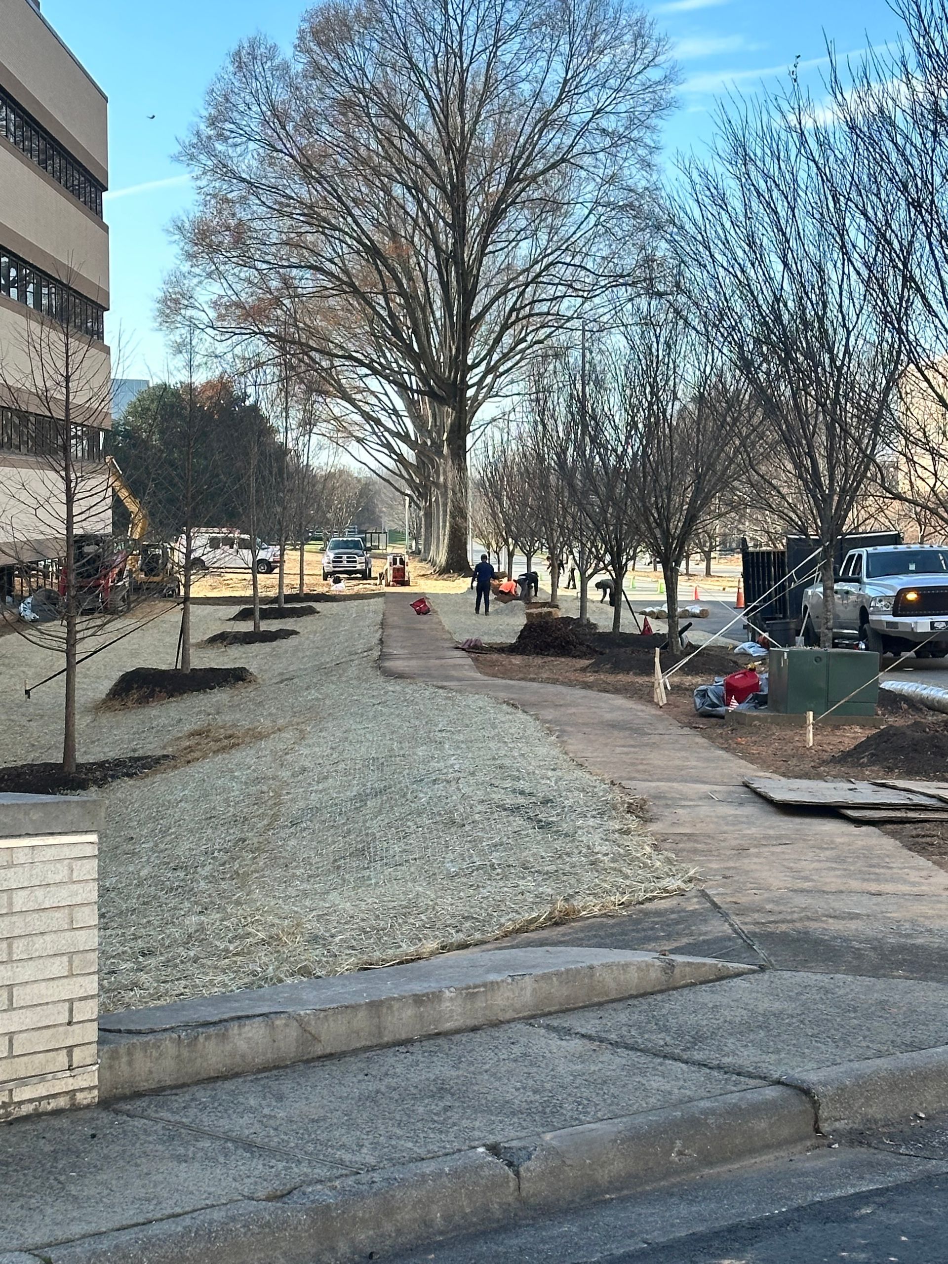 A sidewalk is being built in front of a building