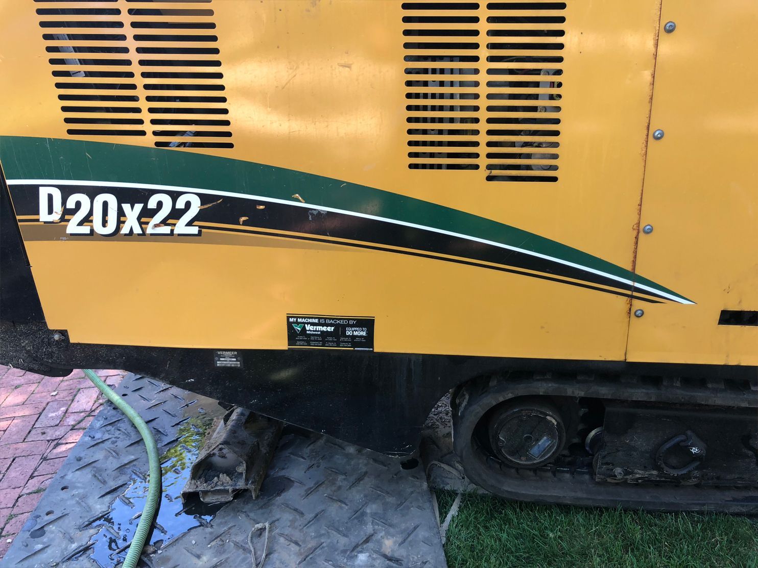 Yellow D20x22 horizontal directional drill with green and black accents, black undercarriage, and tracks.