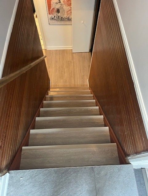 A set of stairs leading up to the second floor of a house.