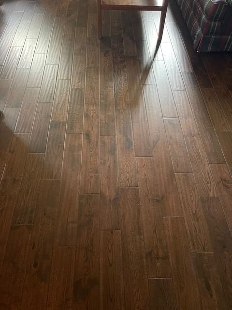 A living room with hardwood floors and a coffee table.