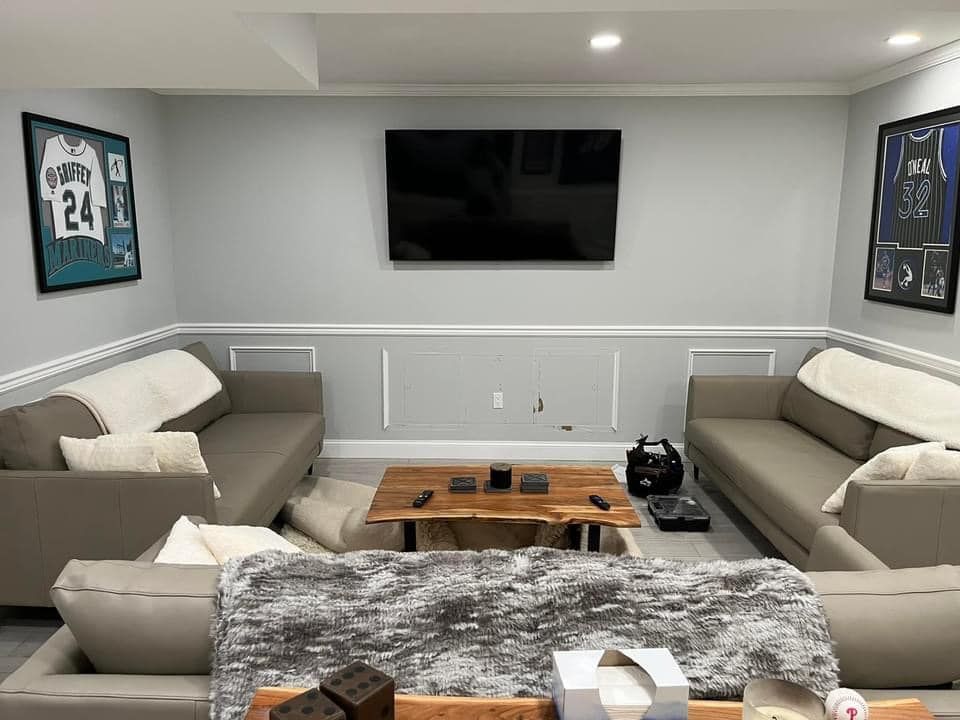 A living room filled with furniture and a flat screen tv.