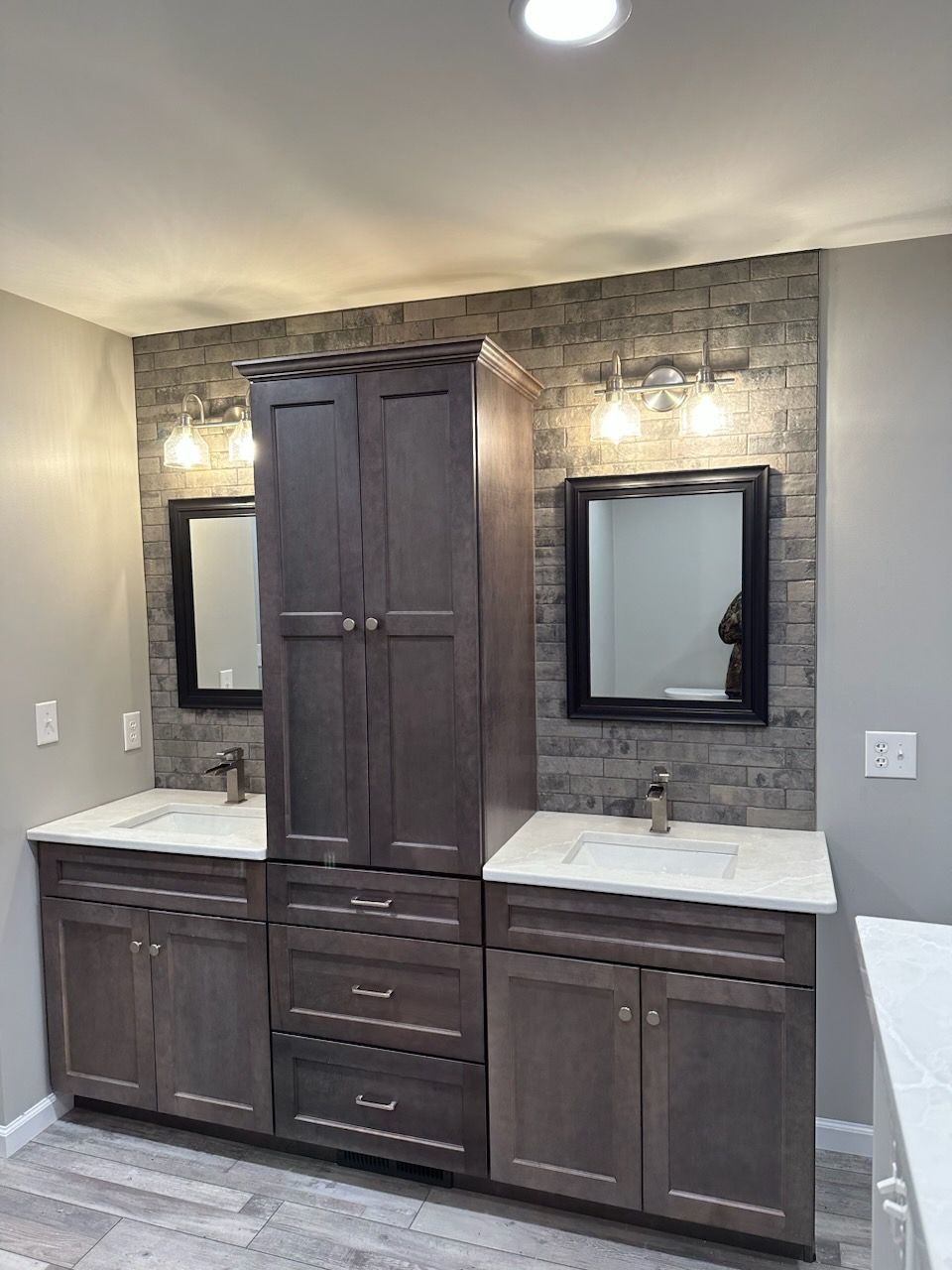 A bathroom with two sinks and two mirrors.