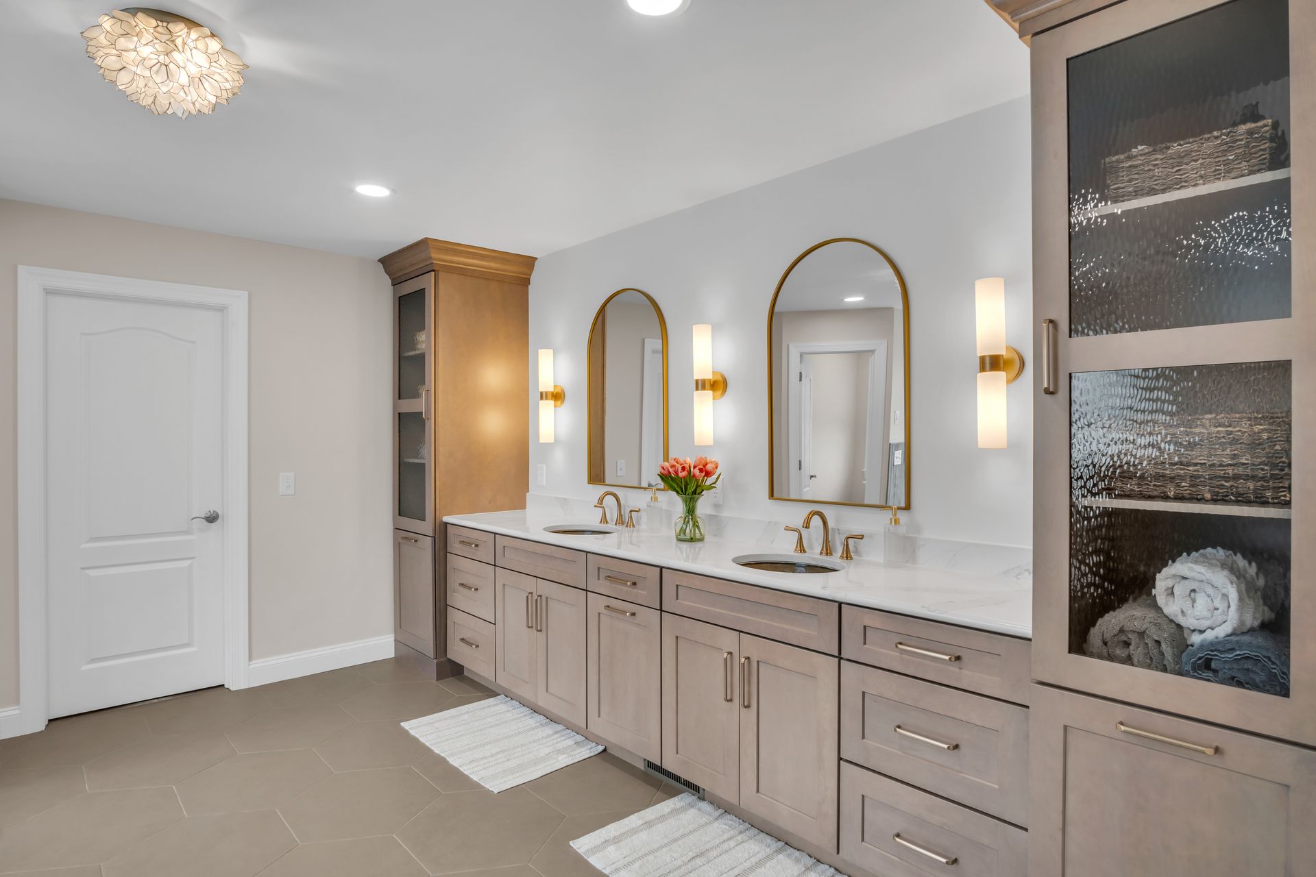 A bathroom with two sinks and two mirrors.