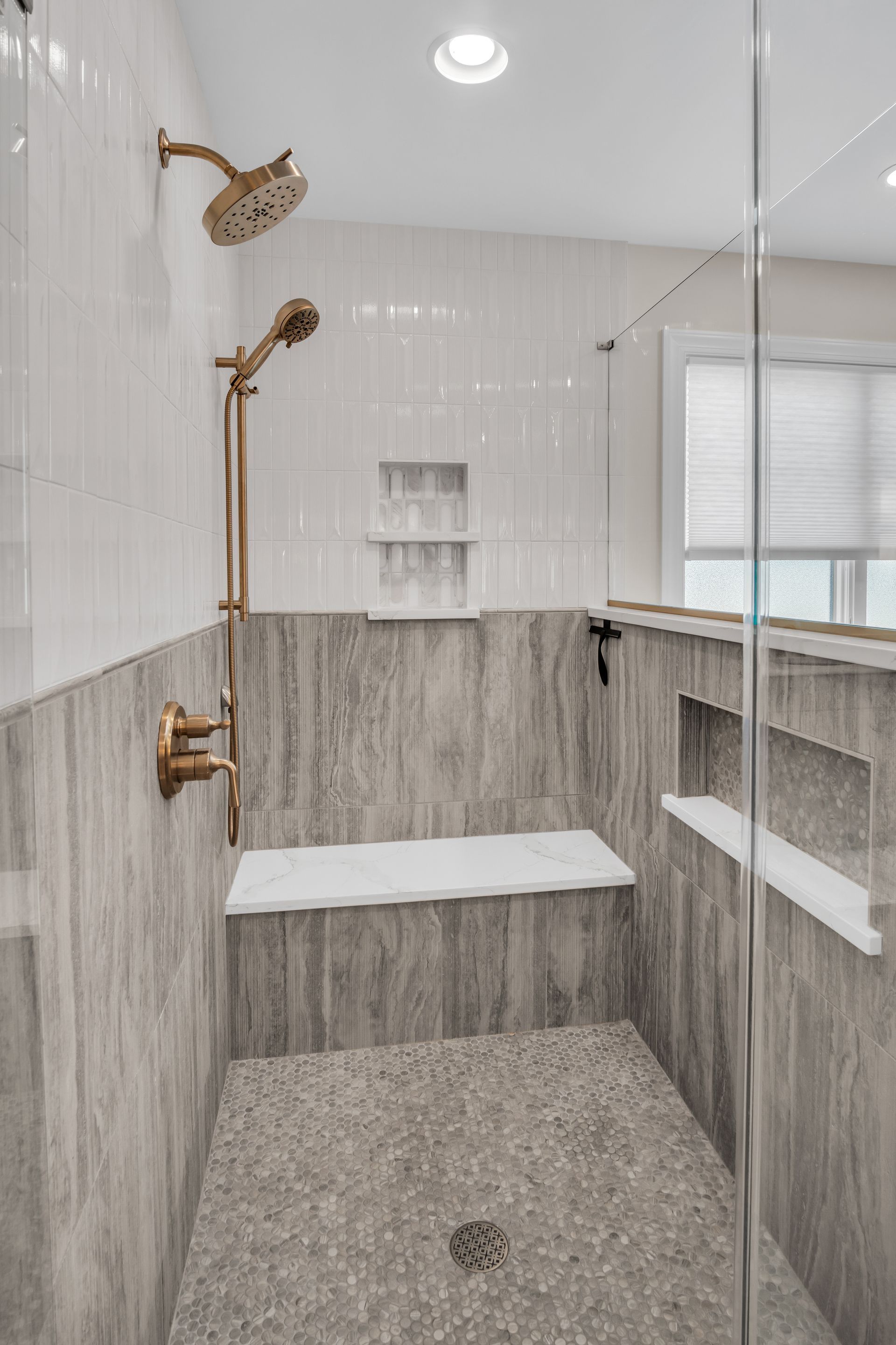 A bathroom with a walk in shower and a bathtub.