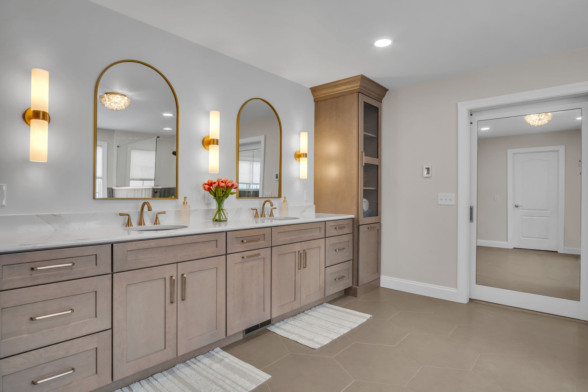 A bathroom with two sinks and two mirrors.