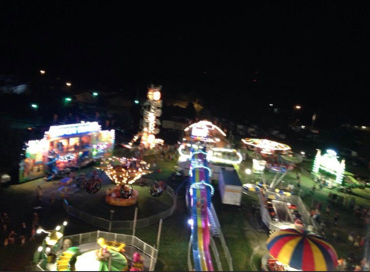 An aerial view of a carnival at night