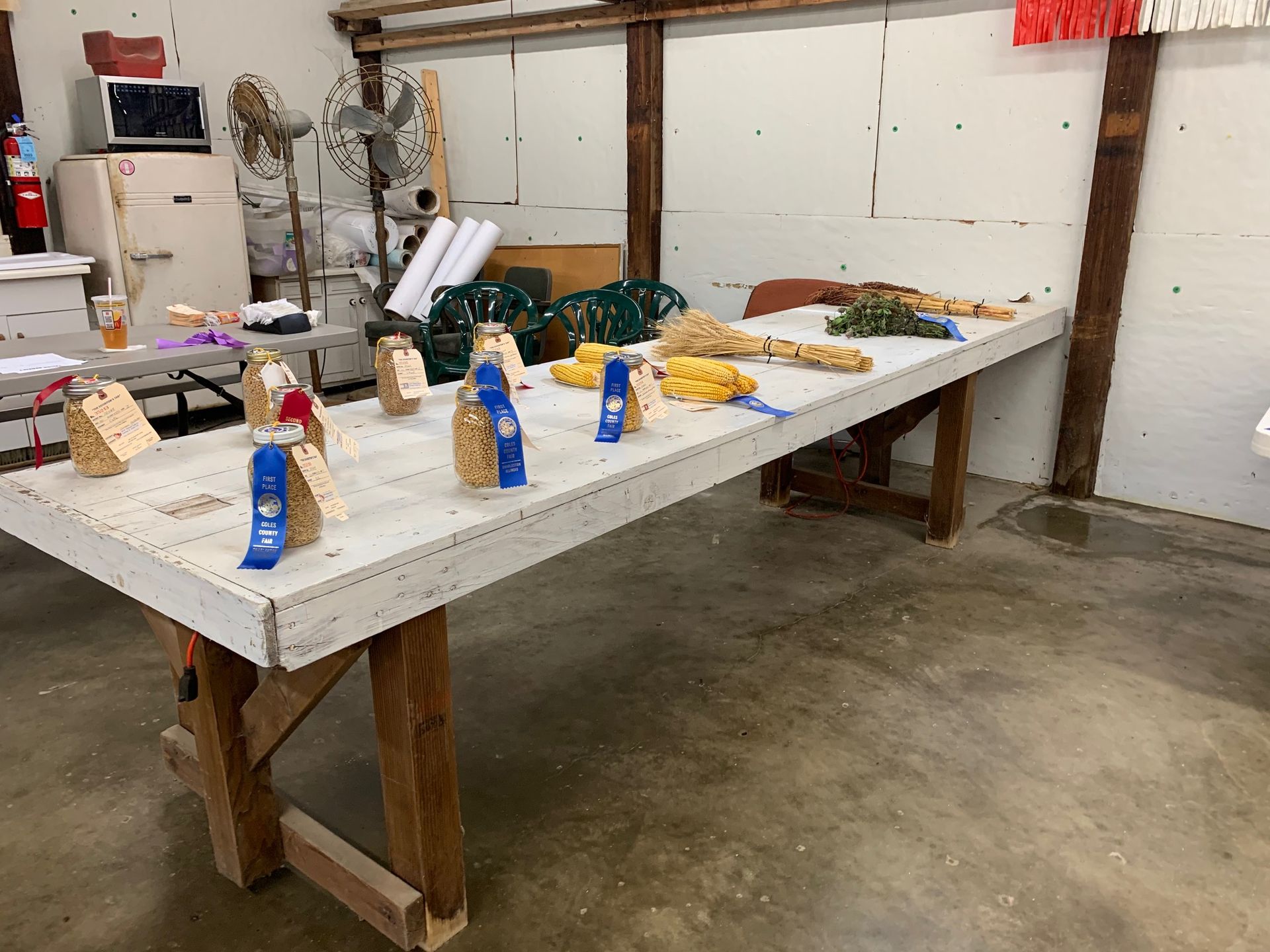A wooden table with ribbons on it in a room