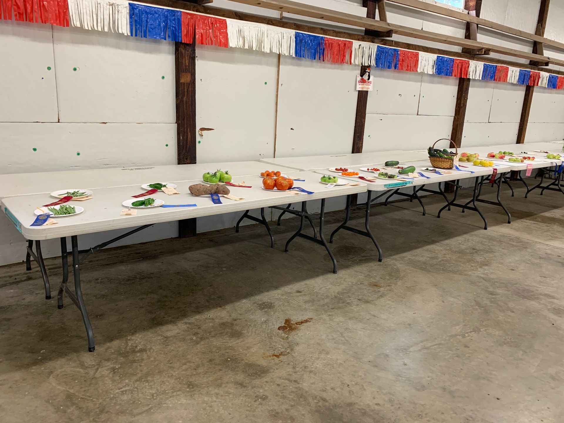 A long table with fruits and vegetables on it