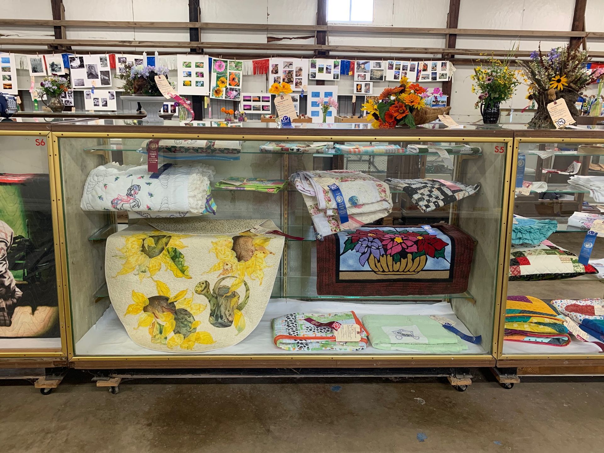 A glass display case filled with a variety of items