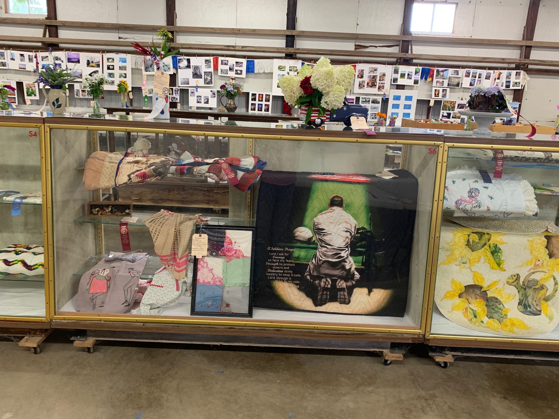 A display case with a picture of a man in a chair on it