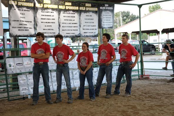 A group of people standing in front of a sign that says old springs