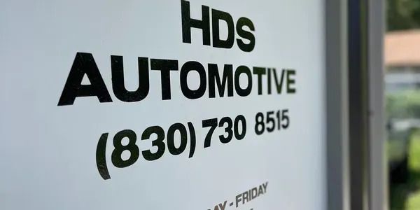 A close up of a hds automotive sign.