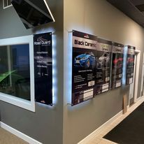 A hallway with a lot of signs on the wall.