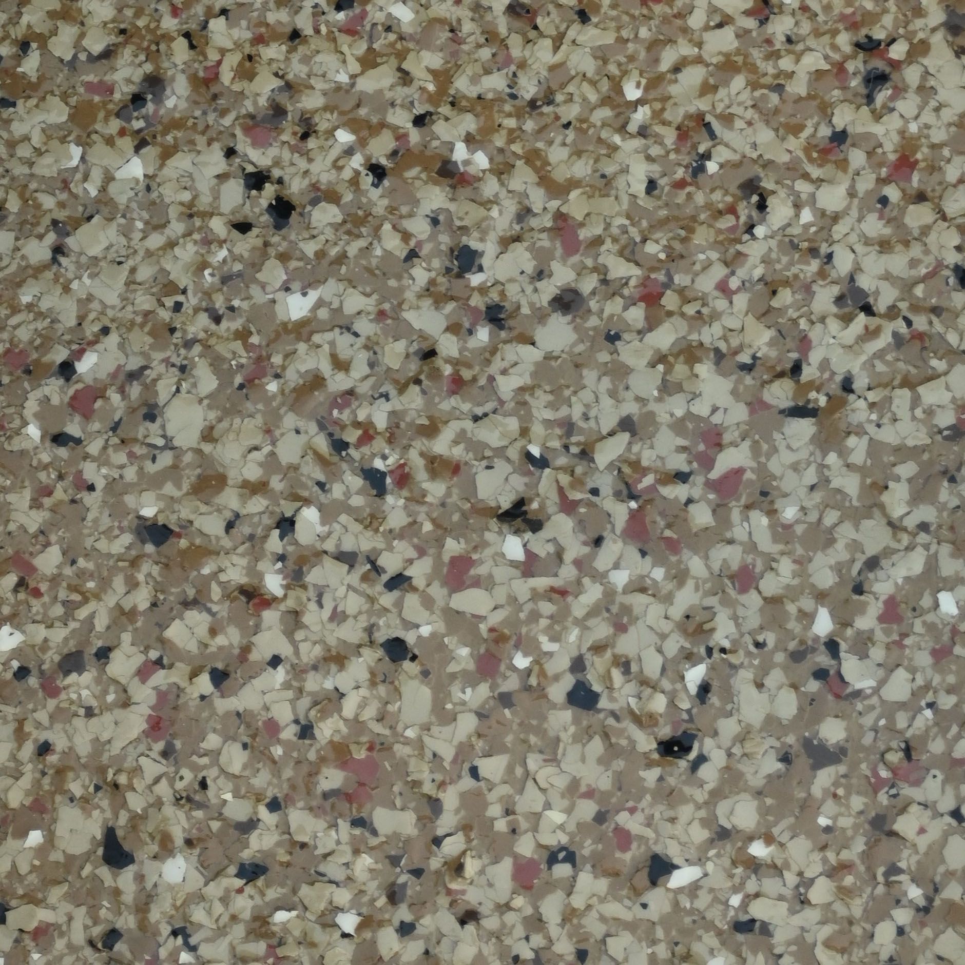 A piece of hazelnut granite is sitting on a white cloth