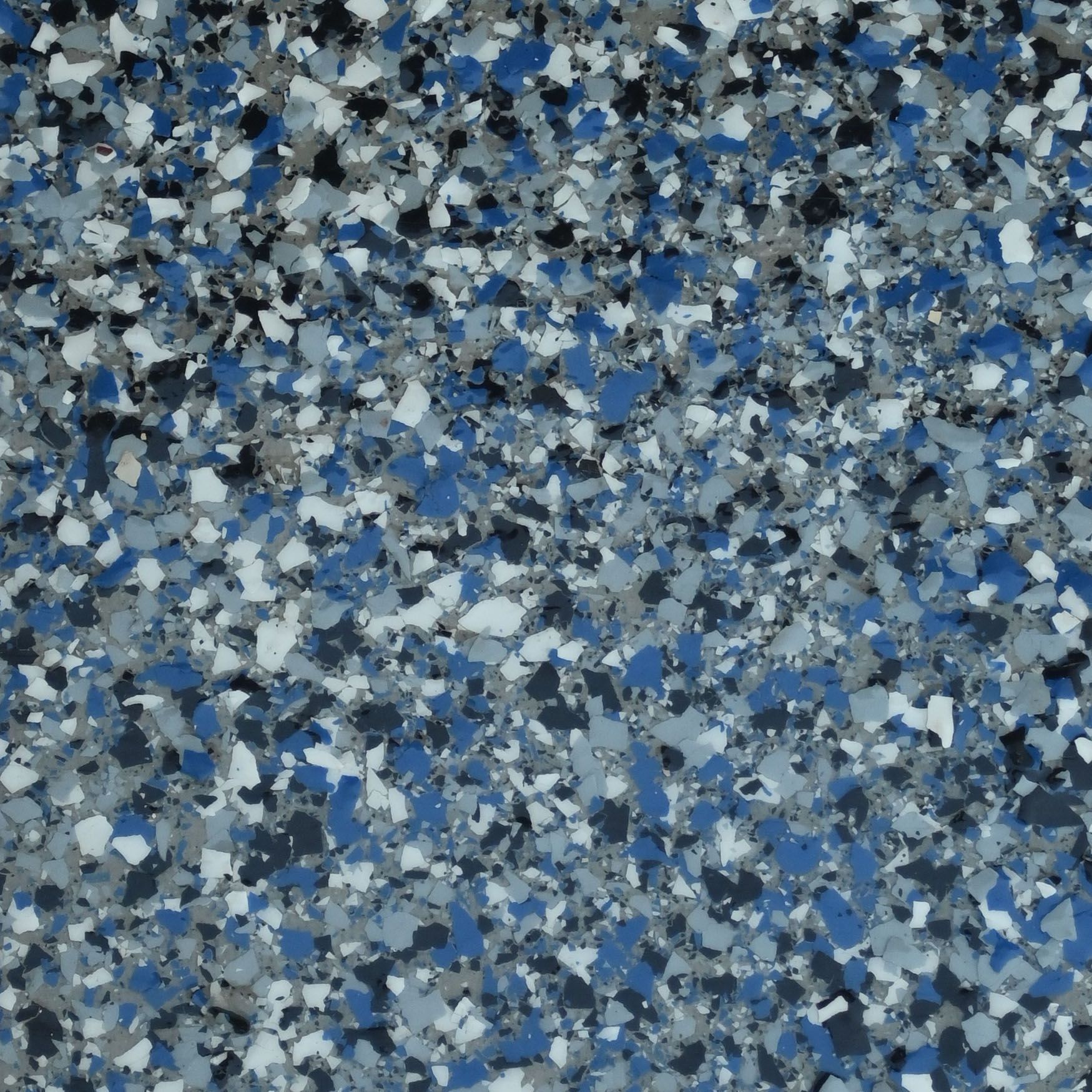 A piece of granite is sitting on a white surface