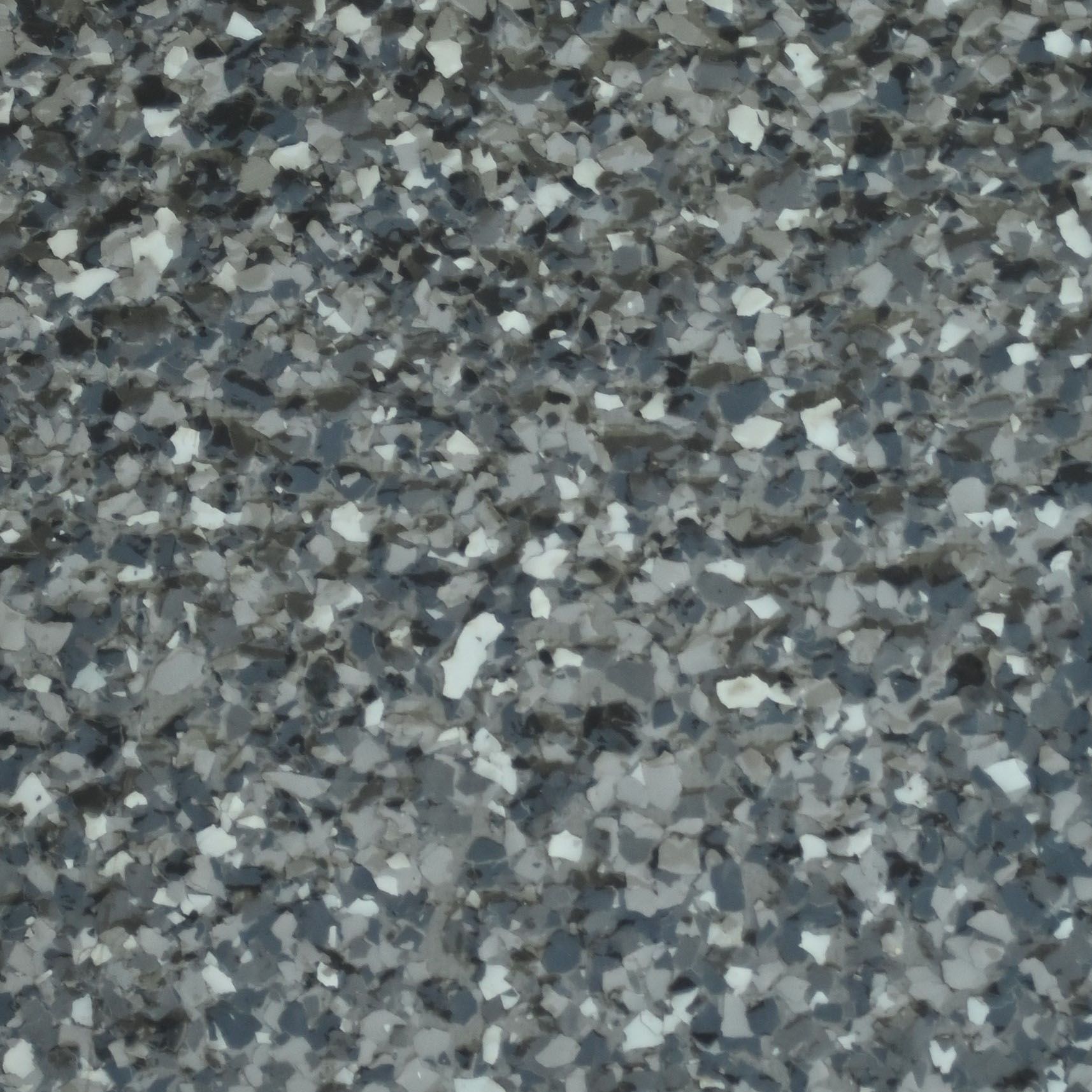 A close up of a piece of silver slate