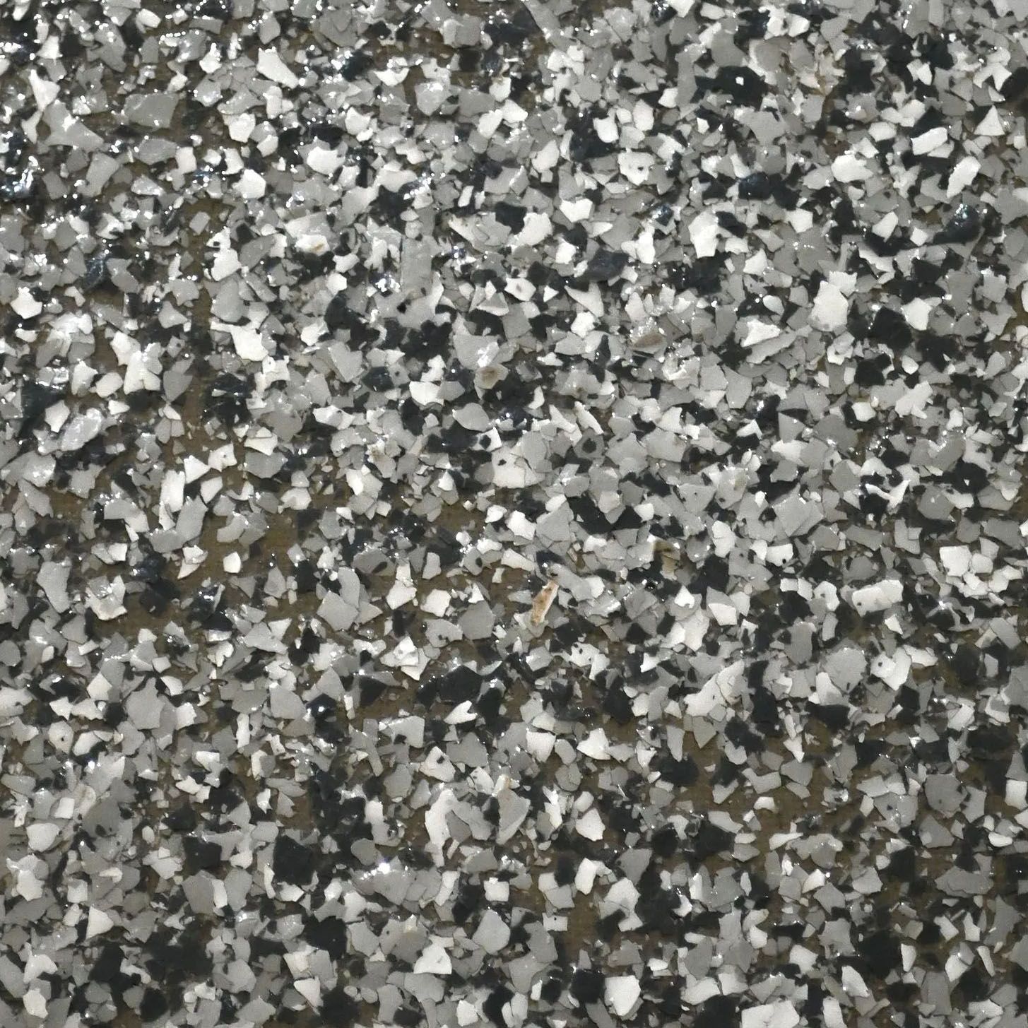 A close up of a piece of slate gray flooring