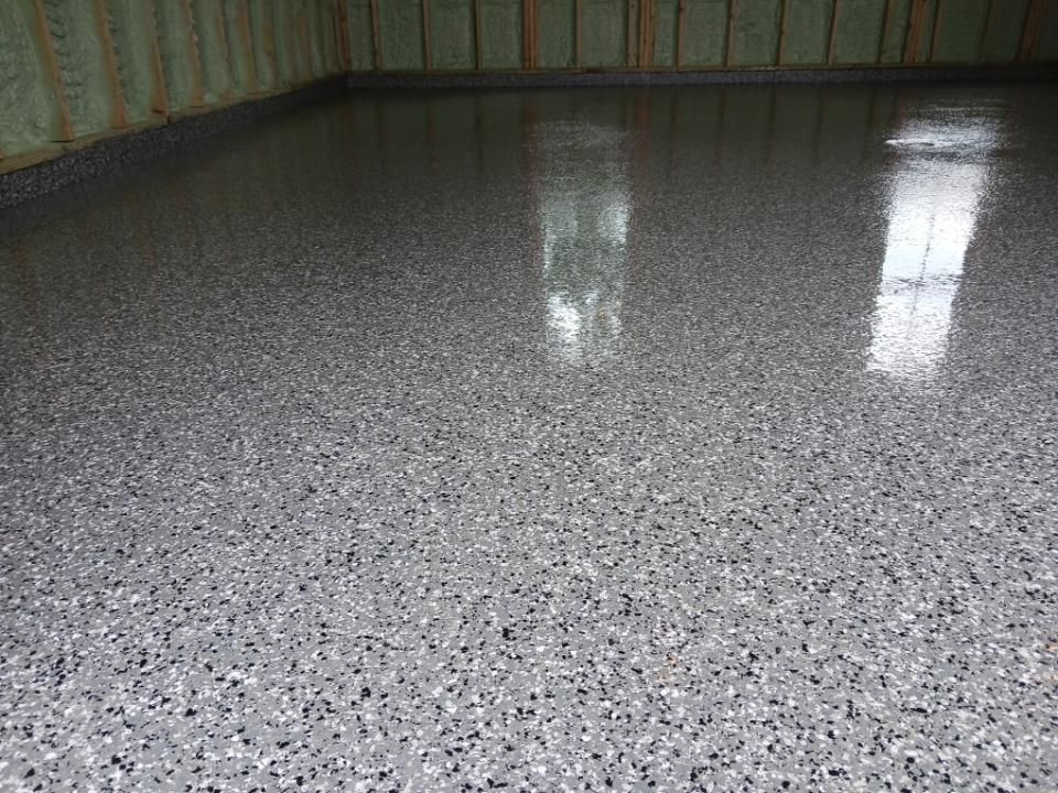 A garage floor with a lot of small stones on it.