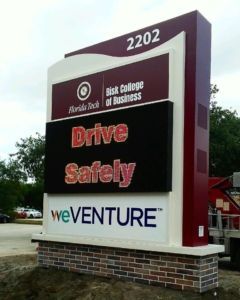 Ironton Business District sign reading “Drive Safely” and “weVENTURE” in red, white, and black.