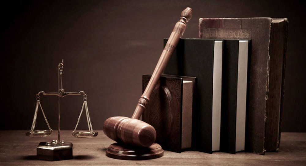 Justice scale, gavel and law books