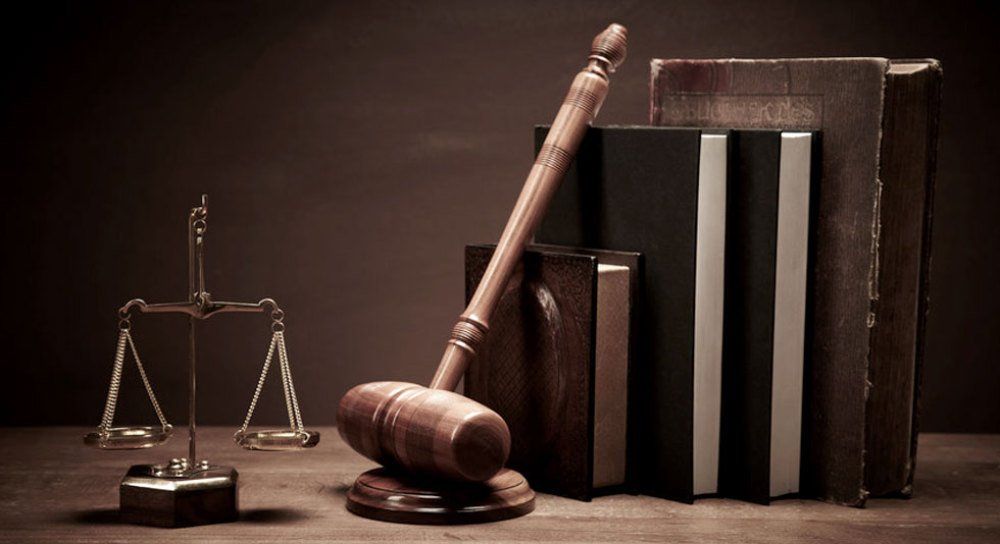 Justice scale, gavel and law books