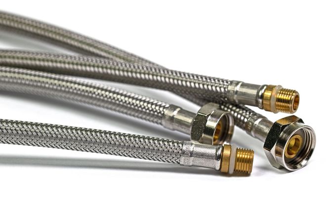 Silver braided stainless steel hose with brass fittings on a white background